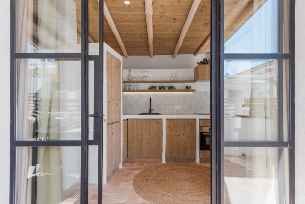 Rustic kitchen with terrace door at Casa Aduar 22 Marbella Old Town
