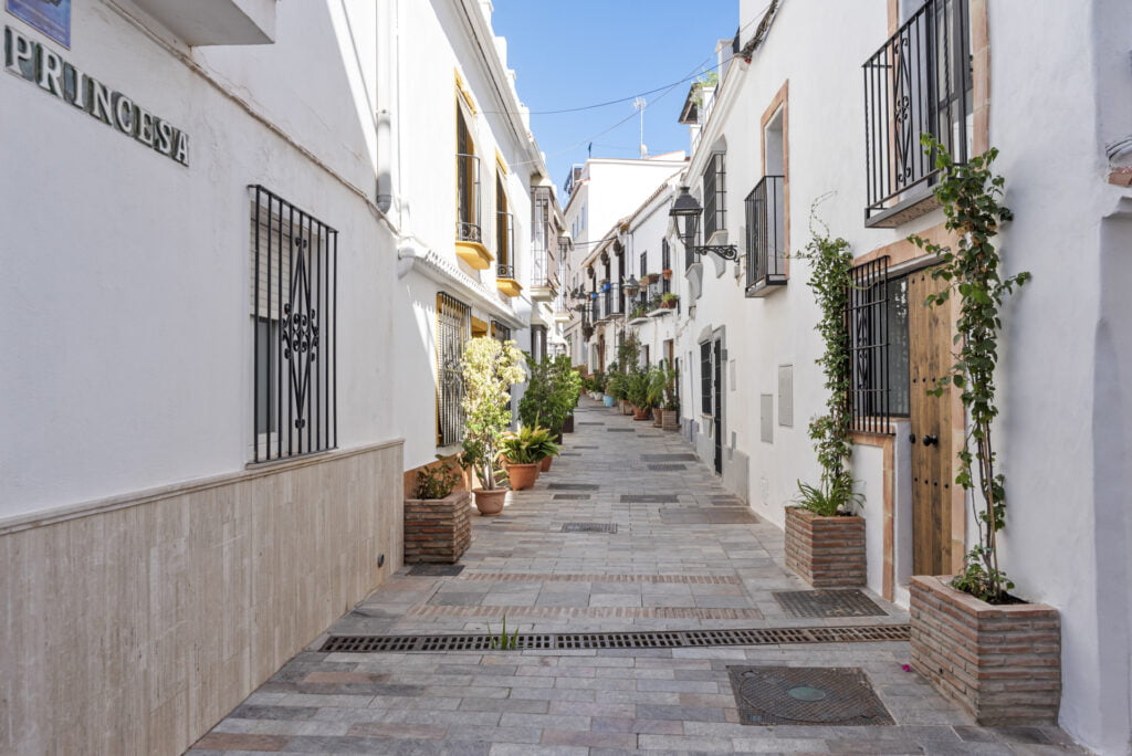 Traditional Andalusian street with whitewashed houses near Casa Aduar 22 Marbella Old Town