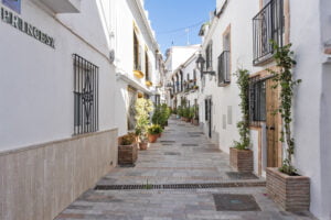 Traditional Andalusian street with whitewashed houses near Casa Aduar 22 Marbella Old Town