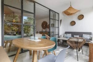 Terrace at Jardín de los Pinos holiday townhouse in Marbella, with dining area and garden view