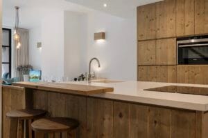 Modern kitchen with wooden cabinets and sink – Jardín de los Pinos Marbella
