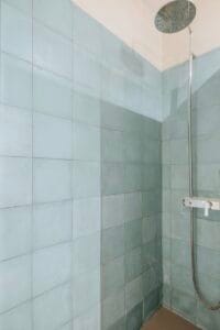 Walk-in shower with light blue tiles – Jardín de los Pinos Marbella