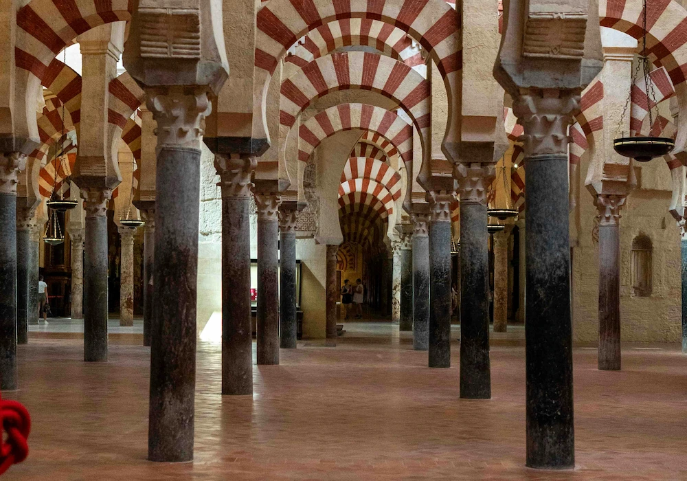 Interior of the Mezquita-Cathedral of Córdoba with its iconic red and white arches