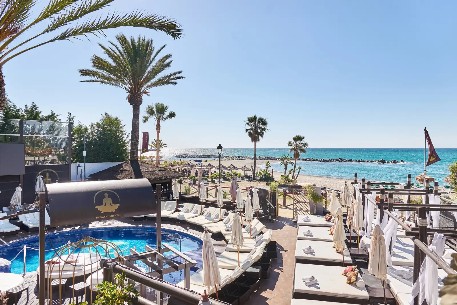 La Sala by the Sea Marbella beach club with pool sunbeds and sea view