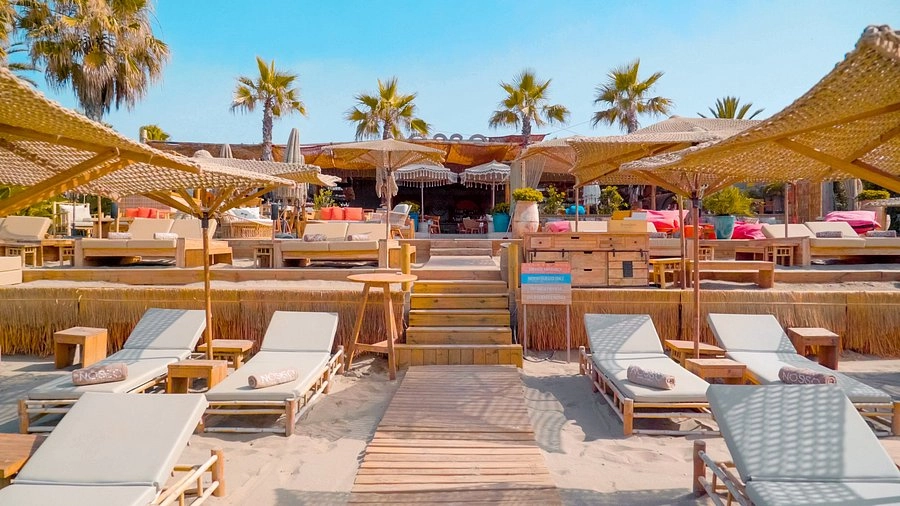 Nosso Summer Club Marbella beach club with sunbeds umbrellas and boho style terrace on the beach